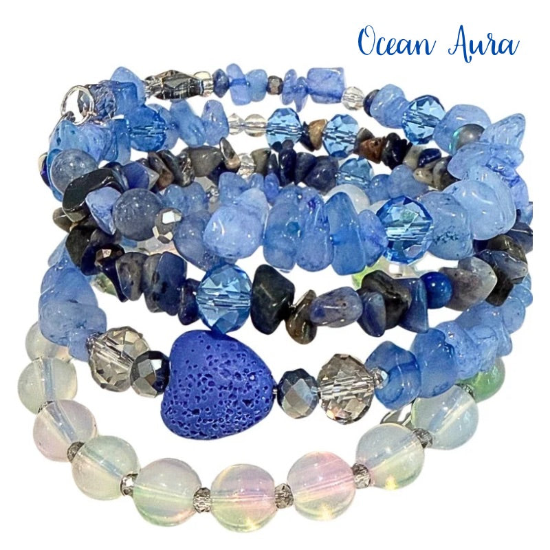 Stack of blue beaded bracelets with a blue stone heart on a white background, labeled 'Ocean Aura'.